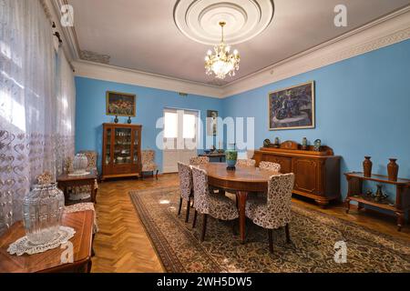 View of the large, blue dining room with wood furniture. At the writer and social activist Mukhtar Auezov Literature Memorial House in Almaty, Kazakhs Stock Photo