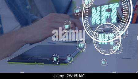 Image of nft in circles over hands of caucasian man using tablet Stock Photo