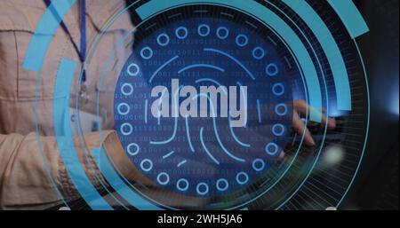 Image of fingerprint in circles over hands of caucasian man typing on laptop Stock Photo