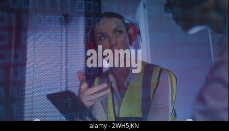 Image of binary coding over diverse people in server room Stock Photo