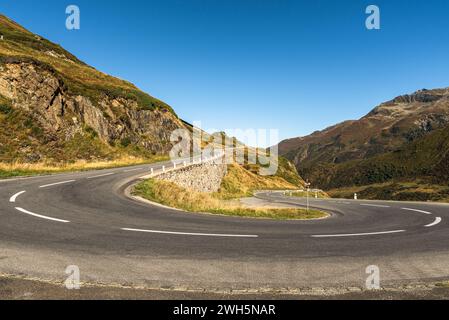 Hairpin bend on empty road at Oberalp Pass, Canton of Graubuenden, Switzerland Stock Photo
