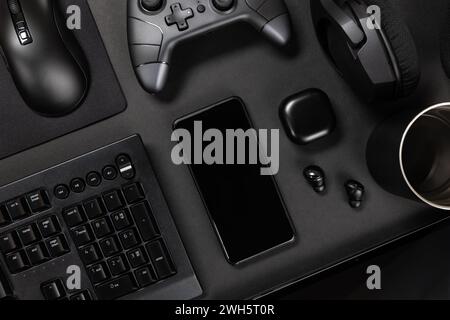 Various modern devices on black table Stock Photo