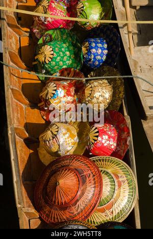 The Sun hats at the Damnoen Saduak floating market in Thailand. Stock Photo