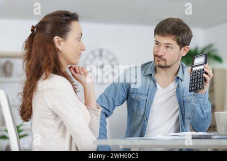 serious couple read documents managing house utility bills Stock Photo