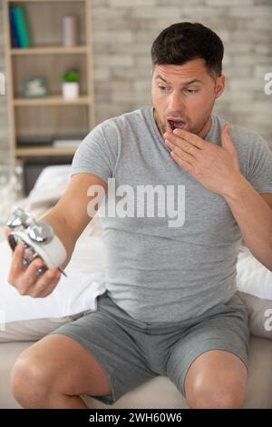 shocked man as he wakes up late for an appointment Stock Photo