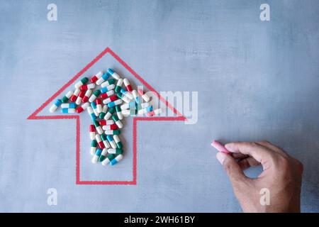 Upward-pointing arrow and a pile of colorful pills. High demand, rising costs of prescription drugs concept. Stock Photo