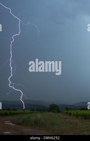 Thunderstorm with lighting over the vineyard of Pierrefeu du var, France Stock Photo