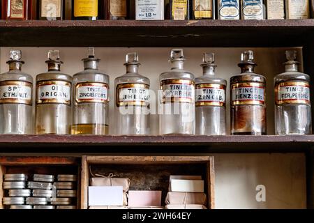 Shelves with medicinal tinctures at an old-fashioned Victorian chemists (Pharmacy), Black Country Living Museum, Dudley, England Stock Photo