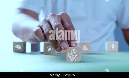 Wooden blocks with symbols. environmental resource concept Stock Photo