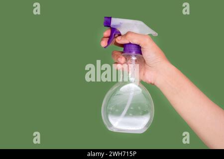Female hand-holding spray bottle Stock Photo
