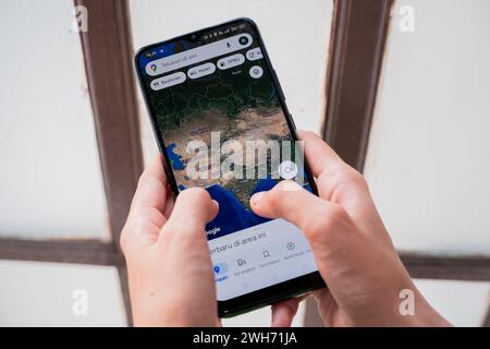 Woman's hand looking for location with map on smartphone Stock Photo