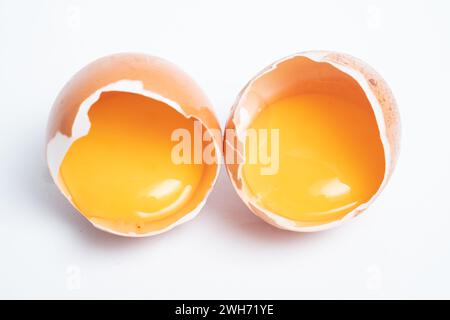 Separated egg yolk in shell isolated on white background, Macro shot Stock Photo