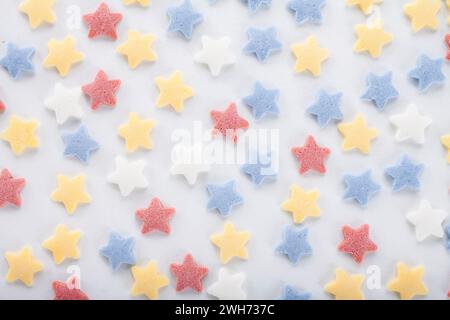 Colorful sugar sprinkles on white background Stock Photo