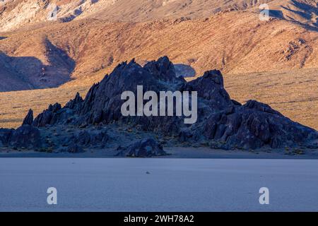 The Grandstand, a quartz monzonite island in the Racetrack Playa in Death Valley National Park in the Mojave Desert, California. Stock Photo