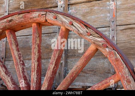 Detail of a wheel of an historic borax ore hauling wagon on display at Furnace Creek in Death Valley National Park in California. Stock Photo