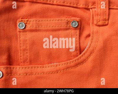 Orange jeans pocket on the right side. Vertical background Stock Photo