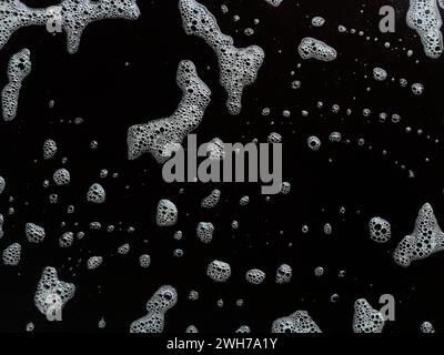 Bubbles soap foam splattered concept texture isolated on black background Stock Photo