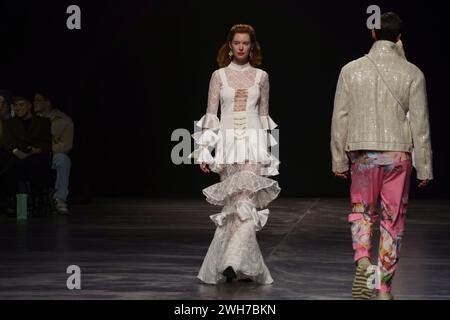 Models show collections by designer Marcel  Ostertag on the catwalk at the Verti Music Hall Stock Photo