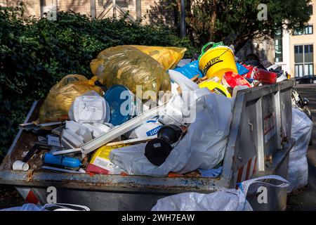 a container and heavy-duty sacks of construction waste are standing in front of St. Gereon Church, Cologne, Germany. ein Container und Schwerlastsaeck Stock Photo