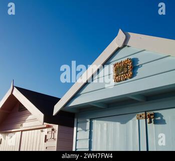 Colorful Wooden Beach Huts Along Avon Beach On A Summers Day, Avon Beach, Christchurch, UK Stock Photo