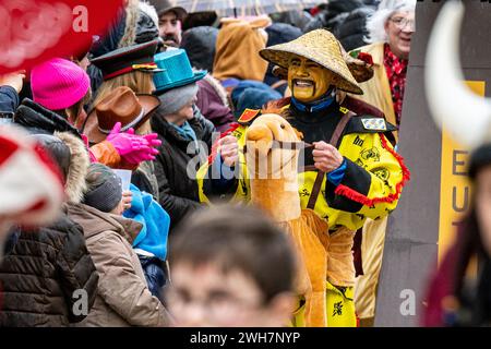 Dietfurt, Germany. 08th Feb, 2024. A man in a Chinese costume takes part in the traditional Chinese carnival parade. As every year on 'Nonsensical Thursday', jesters dressed as Asians parade through the town. The Chinese carnival goes back to a legend according to which the people of Dietfurt simply left a tax collector standing outside the town wall in the Middle Ages. The treasurer is said to have subsequently complained to the bishop, his employer, that the people of Dietfurt were hiding behind their wall 'like the Chinese'. Credit: Armin Weigel/dpa/Alamy Live News Stock Photo