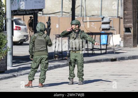 Nablus, Palestine. 08th Feb, 2024. Israeli soldiers stand on guard near the site where an Israeli soldier shot a Palestinian youth at Israeli Deir Sharaf checkpoint. Palestinian Red Crescent ambulance personnel reported that the soldier who shot a young man prevented them from treating him and left him to bleed to death. Credit: SOPA Images Limited/Alamy Live News Stock Photo