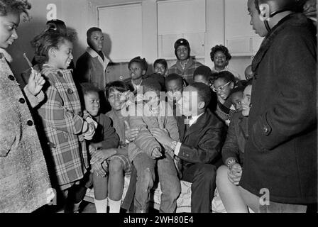 Dr. Martin Luther King Jr. Engaging With Young Admirers During a Civil Rights Meeting Stock Photo