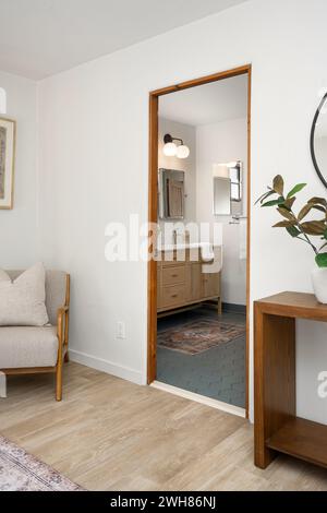 Cozy living room adorned with stylish furniture, featuring pristine white walls and flooring Stock Photo