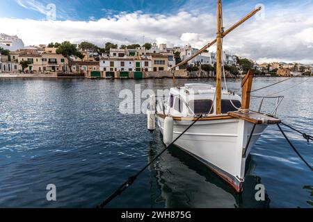 A modern version of a tradional Majorcan fishing boat Llagut, is moored in the port of Porto Petro, Majorca, Mallorca, Balearic Islands, Spain Stock Photo