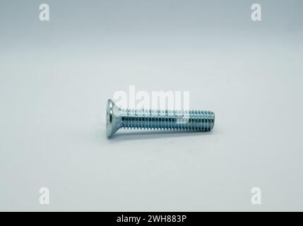 Screw on floor in center of room Stock Photo