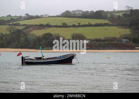 Salcombe to East Portlemouth ferry at anchor in the estuary with East Portlemouth and beach in view in the background, from beach near Whitestrand Stock Photo