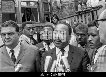 Dr Martin Luthur King and Civil Rights Leader Delivers a Speech Surrounded by Associates and Onlookers Stock Photo