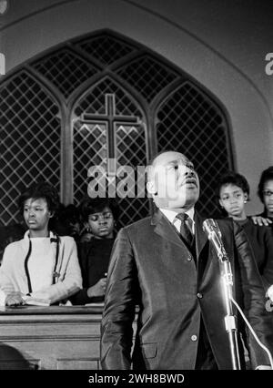 Dr. Martin Luthur King Delivers an Inspiring Speech at a Historic Church Podium Stock Photo