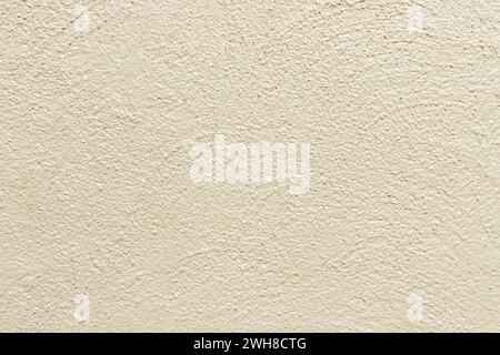 Beige painted stone wall background, abstract texture. Stock Photo