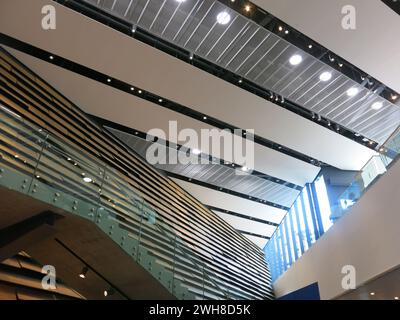 Multiple textures, materials, lines and shapes: interior design of the atrium at Scotland's iconic museum V&A Dundee by Kengo Kuma Associates. Stock Photo