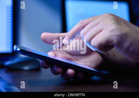 Hight view of businessman holding mobile pone with blank screen on ...