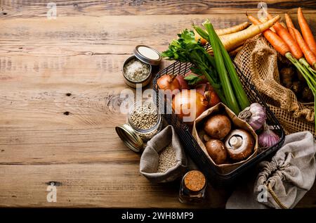 Healthy food Ingredients for mushroom soup Eco-friendly packaging reusable bag Plastic free Zero waste lifestyle on wooden table background copy space Stock Photo