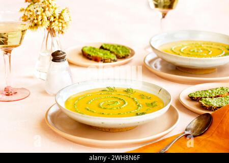 Carrot Red Lentil Soup with Carrot Top Pesto Stock Photo