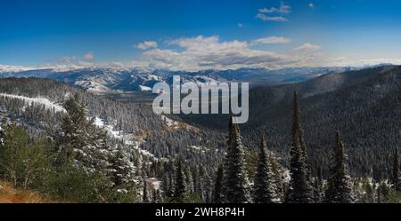 View of Jackson Hole and western Wyoming from near the top of Teton Pass Highway with a dusting of early autumn snow Stock Photo