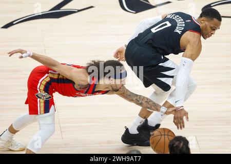 Los Angeles, USA. 7th Feb, 2024. New Orleans Pelicans' Jose Alvarado (L) and Los Angeles Clippers' Russell Westbrook vie for the ball during the 2023-2024 NBA regular season match in Los Angeles, the United States, Feb. 7, 2024. Credit: Ringo Chiu/Xinhua/Alamy Live News Stock Photo