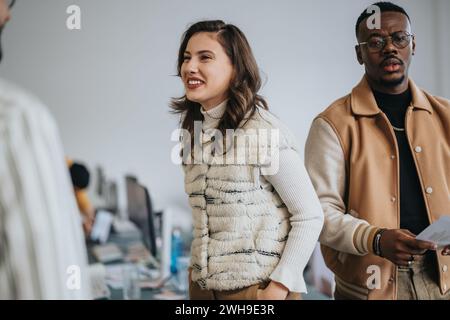 A diverse group brainstorming and collaborating on business strategies in a creative office environment. Stock Photo