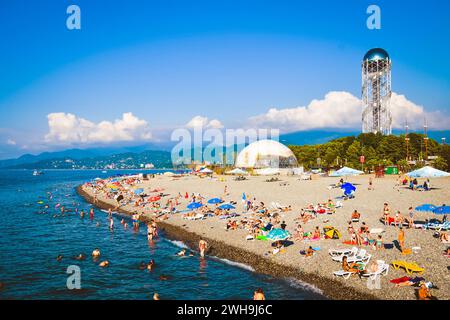 Aerial top view people at famous popular main iveria Beach in Batumi under umbrellas in hot sunny day Stock Photo