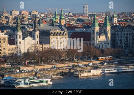 Budapest: panoramic view with The Main Parish Church of the Assumption, the Orthodox Cathedral of Our Lady and Danube River. Hungary Stock Photo