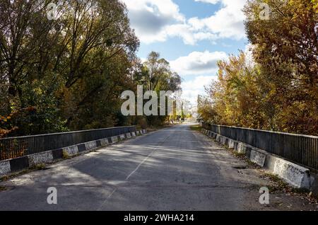 Barrier, designed to prevent the exit of the vehicle from the curb or bridge. Guarding rail on suburban road Stock Photo