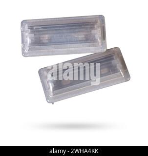 A  transparent plastic shade for illuminating the interior on a white isolated background in a photo studio - spare parts for repairing a car interior Stock Photo