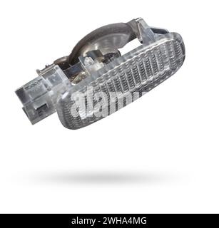 A  transparent plastic shade for illuminating the interior on a white isolated background in a photo studio - spare parts for repairing a car interior Stock Photo