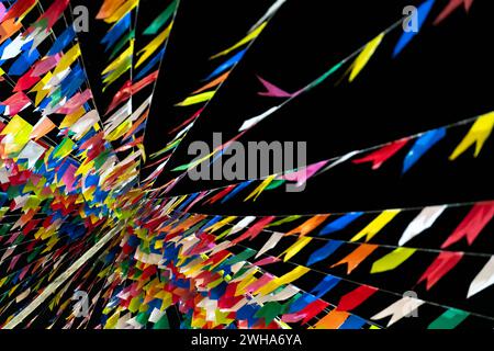 Colorful Abstract Ribbons Streaming Across a Dark Background Stock Photo