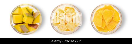 Slices of ripe mango and dried slices and freeze bites on white background.Top view. Stock Photo