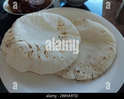 Rice Roti Plate Indian Roti on traditional Indian Plate, isolated on white Stock Photo ...