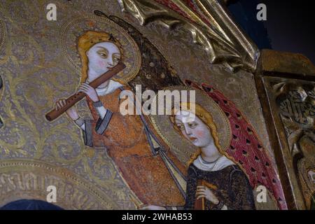angel with medieval transverse flute, Mother of God of humility with musical angels altarpiece, Francesc Comes, 1390-94, Parish of La Mare de Deu dels Stock Photo